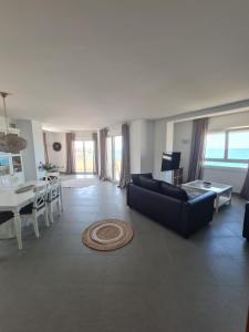 a living room with a couch and a table at Moraira Beach in Moraira