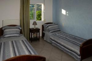 Postel nebo postele na pokoji v ubytování D & K Guest House