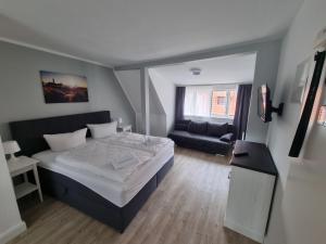 Postel nebo postele na pokoji v ubytování Nikolai Appartements