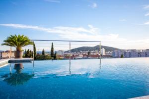 a swimming pool with a view of a city at Art Hotel in Split