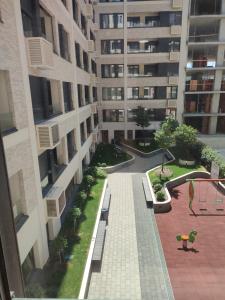 an empty courtyard of a building with a playground at Duki New Belgrade in Belgrade