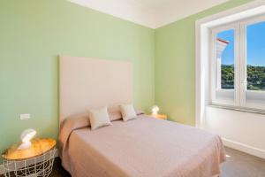 A bed or beds in a room at Casa Mariavittoria