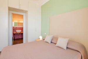 A bed or beds in a room at Casa Mariavittoria