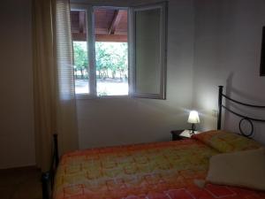 Postel nebo postele na pokoji v ubytování Agriturismo La Barca In Secca