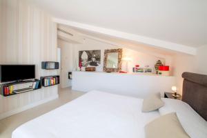 A bed or beds in a room at Casa Mariavittoria