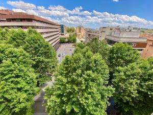 an overhead view of a city with trees and buildings at B&B BLESSED bilocale in Perugia