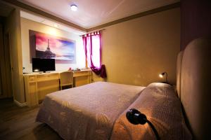 TV a/nebo společenská místnost v ubytování Hotel Benedetti