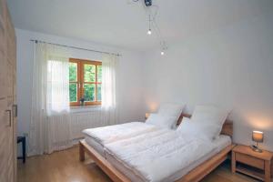 Łóżko lub łóżka w pokoju w obiekcie Ferienwohnung Miedl