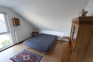 Una cama o camas en una habitación de Zweit-Traumwohnung