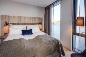 Postel nebo postele na pokoji v ubytování Quality Hotel Ramsalt