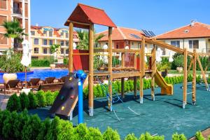 a playground in a resort with a slide at Cascadas Ravda in Ravda