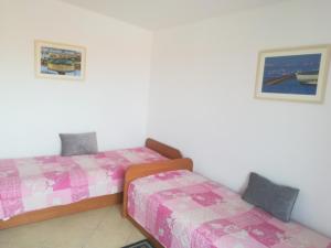 Postel nebo postele na pokoji v ubytování Apartments Martinac