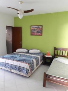 Ένα ή περισσότερα κρεβάτια σε δωμάτιο στο Aluguel temporário