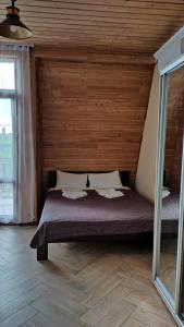 Postel nebo postele na pokoji v ubytování Dom Fedorovyh