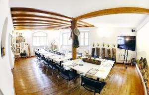 a large dining room with a long table and chairs at Hotel Elch Boutique in Nuremberg