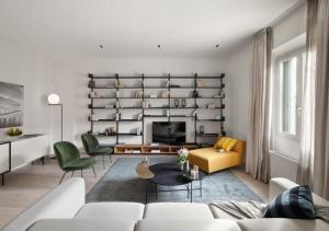 a living room with a couch and a table at BB Hotels Aparthotel Collection Il Michelangelo in Florence