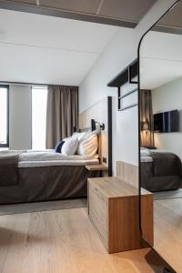 Postel nebo postele na pokoji v ubytování Quality Hotel Ramsalt