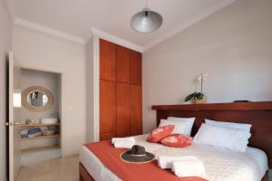 Postel nebo postele na pokoji v ubytování Marilena Apartments