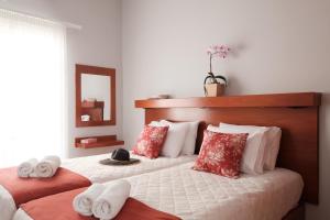 Postel nebo postele na pokoji v ubytování Marilena Apartments