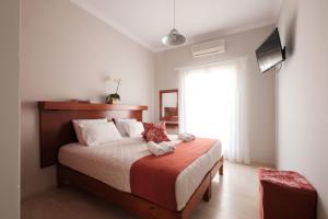 Postel nebo postele na pokoji v ubytování Marilena Apartments