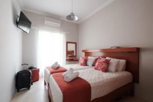 Postel nebo postele na pokoji v ubytování Marilena Apartments