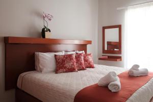 Postel nebo postele na pokoji v ubytování Marilena Apartments