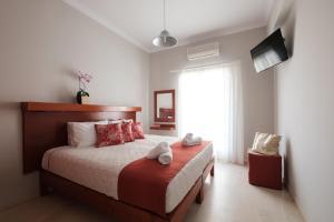 Postel nebo postele na pokoji v ubytování Marilena Apartments