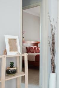 Postel nebo postele na pokoji v ubytování Marilena Apartments