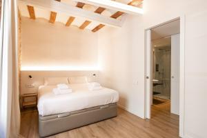 Postel nebo postele na pokoji v ubytování Decô Apartments Barcelona-Born Apt.