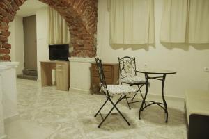 a room with a table and two chairs and a table at Top Center Detached Apartment Studio in Sofia