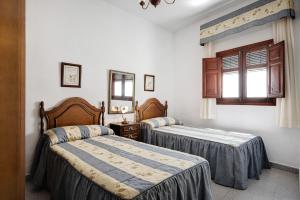 Ένα ή περισσότερα κρεβάτια σε δωμάτιο στο Casa Carmen - Sólo Familias