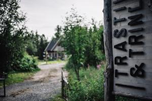 a sign on the side of a house next to a road at Trasti & Trine Boutique Hotel in Alta