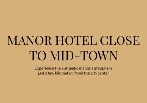 a sign that reads manor hotel close to midtown at Hotel Scheelsminde in Aalborg