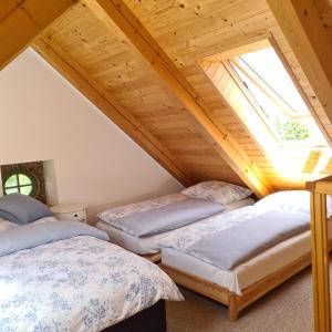 A bed or beds in a room at Pension Sodomkův statek Czap