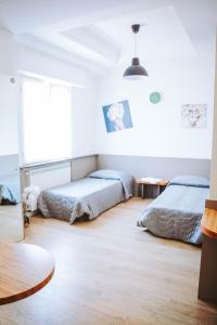 Кровать или кровати в номере Avezzano 3e60