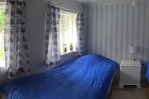 En eller flere senge i et værelse på Gammelt Mandø hus Hyggebo