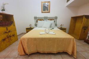 Postel nebo postele na pokoji v ubytování LUNA & MARTE, TAORMINA CENTER - (CASA VACANZA)