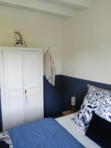 Giường trong phòng chung tại La Petite Maison de la Villa Xaran Erdian