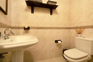 a bathroom with a toilet and a sink at Apartamento Vistas de Icod in Icod de los Vinos +13 photos