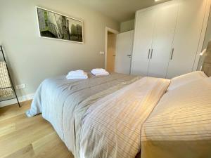 Postel nebo postele na pokoji v ubytování PUENTE SANTIAGO APOSTOL