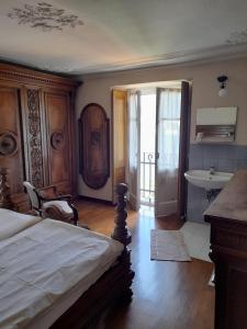 A bed or beds in a room at Albergo Milano 1920