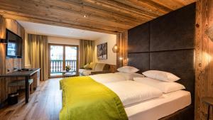 Posteľ alebo postele v izbe v ubytovaní Alpenresort Fluchthorn + 37 fotografií