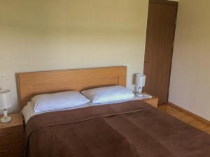 Ένα ή περισσότερα κρεβάτια σε δωμάτιο στο Guest House Maradona