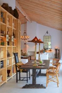 a dining room with a table and chairs at Rufino Quinta in Estevais