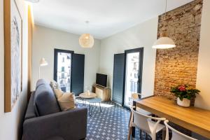TV a/nebo společenská místnost v ubytování Apartamentos El Patio Plaza Mayor Cáceres