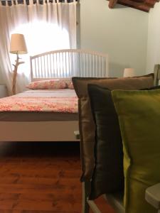 Postel nebo postele na pokoji v ubytování B&B BAGOLARI