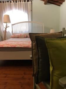 Postel nebo postele na pokoji v ubytování B&B BAGOLARI