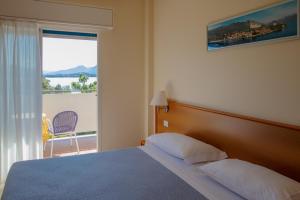 Een bed of bedden in een kamer bij Hotel Alpi