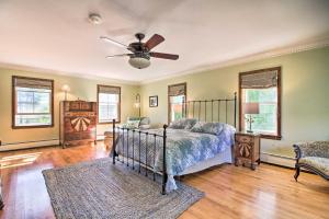a bedroom with a bed and a ceiling fan at Vintage Schroon Lake Farmhouse w/ Private Beach! in Schroon Lake