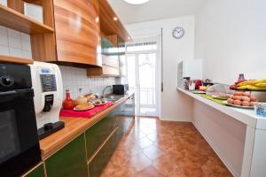 a kitchen with a counter with food on it at Verona Maison in Verona